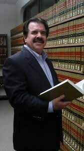 Michael Yates holding law book Yates Photo paralegal and chiropractor